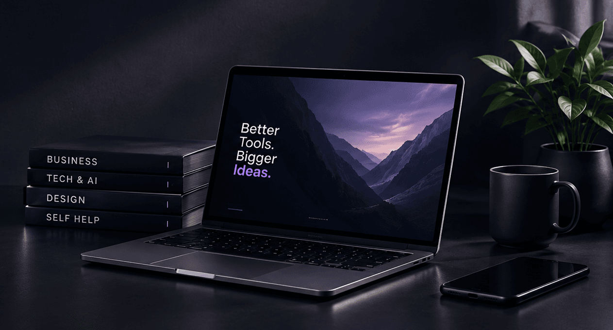 A laptop on a dark desk beside a stack of books labelled Business, Tech and AI, Design and Self help